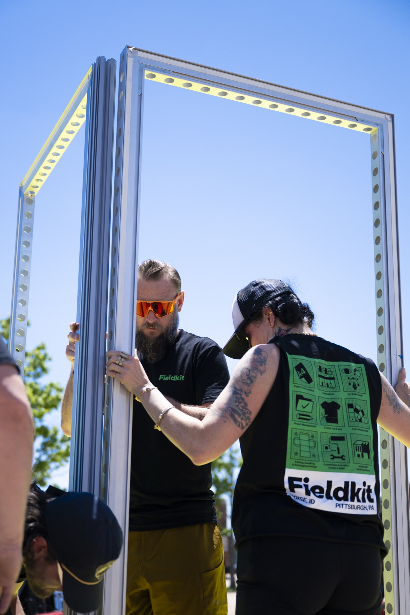Fieldkit crew assembling an aluminum frame on site